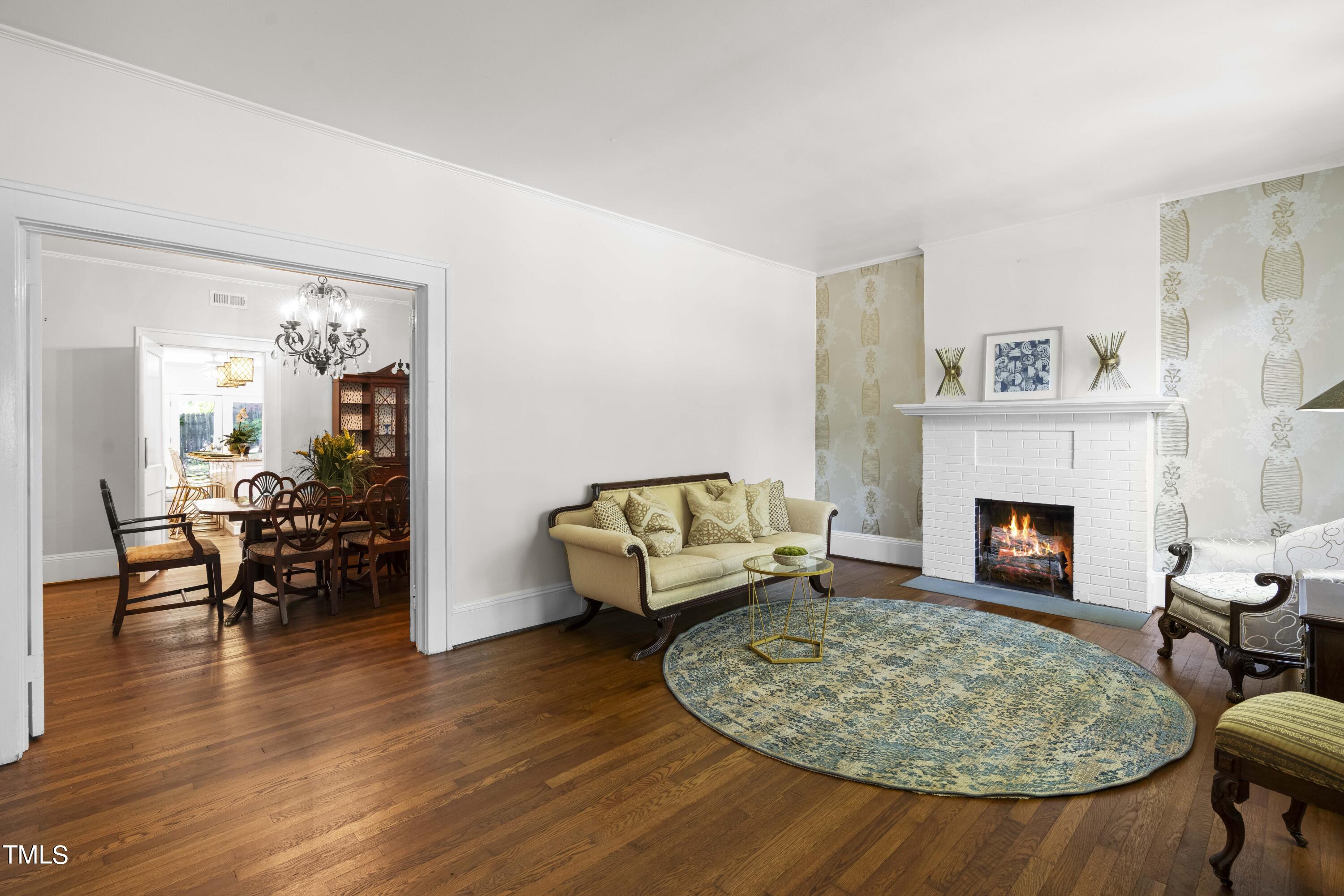 504 Holden Street Raleigh, NC 27604 - Photo 2 of 26 a living room with furniture and a fireplace