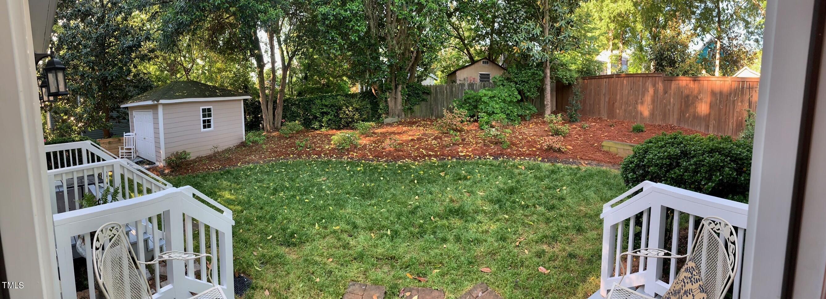 504 Holden Street Raleigh, NC 27604 - Photo 21 of 26 a view of house with backyard and trees