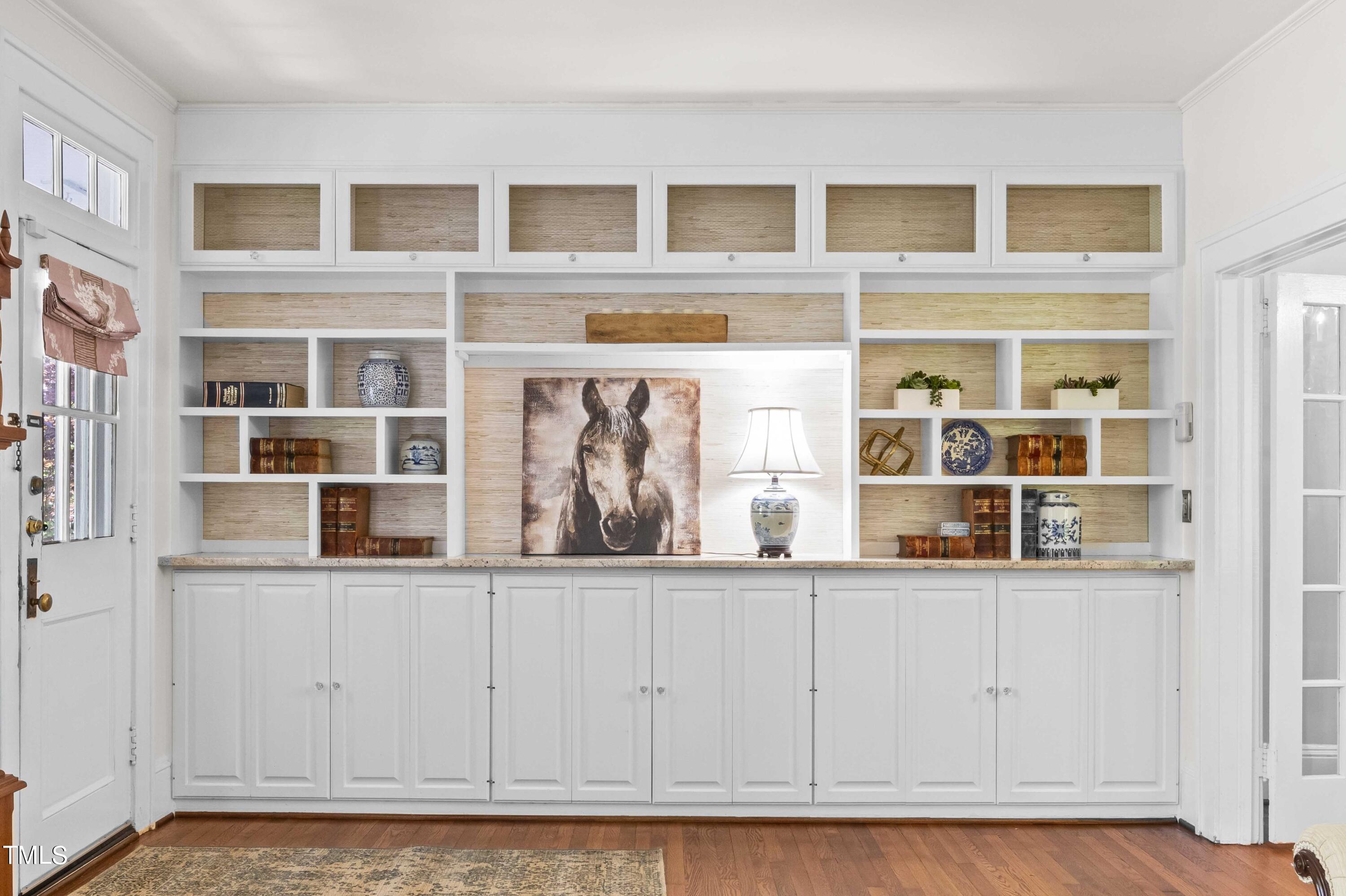 504 Holden Street Raleigh, NC 27604 - Photo 4 of 26 a view of a kitchen area with furniture and wooden floor