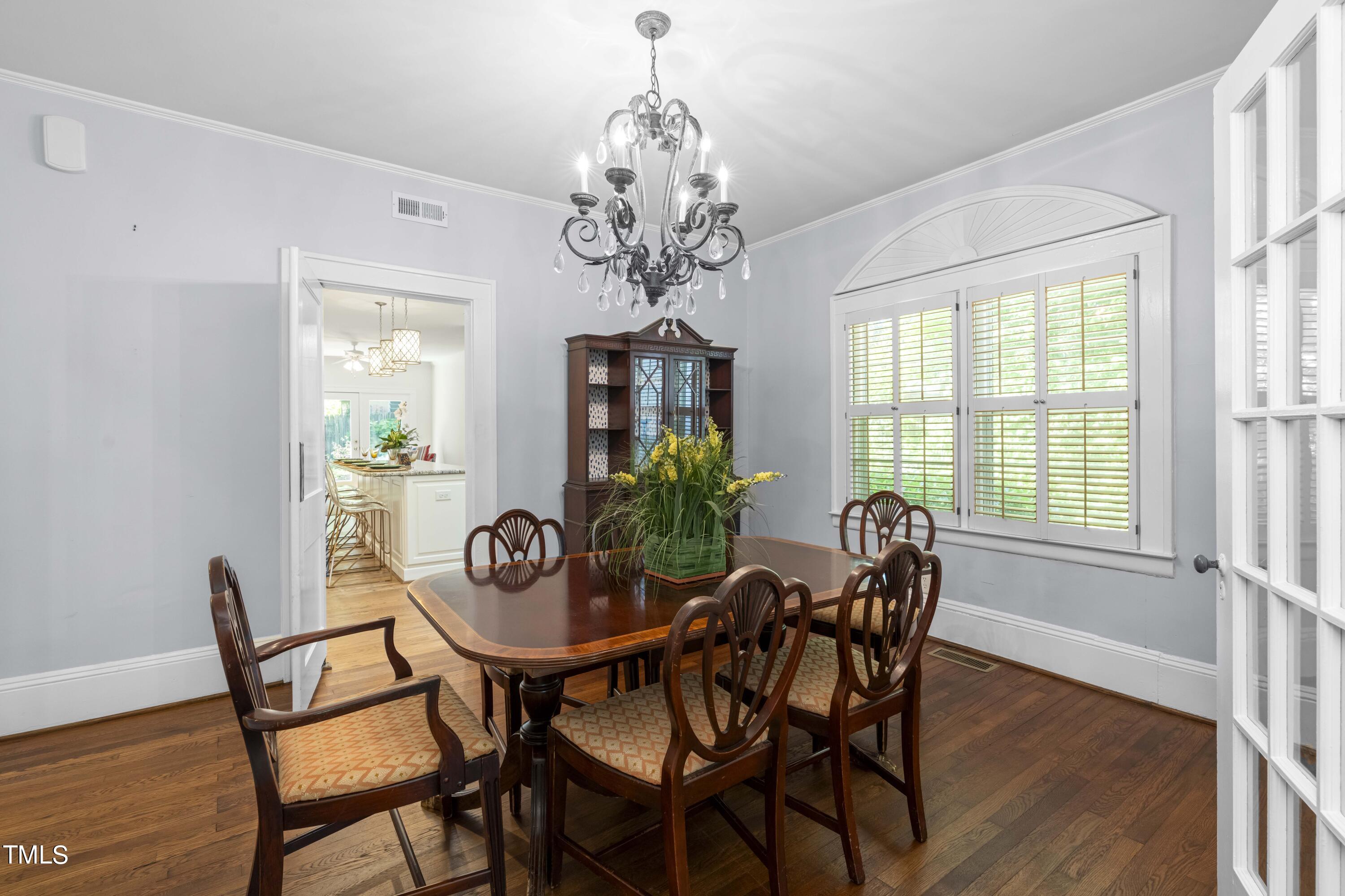 504 Holden Street Raleigh, NC 27604 - Photo 6 of 26 a view of a dining room with furniture window and wooden floor