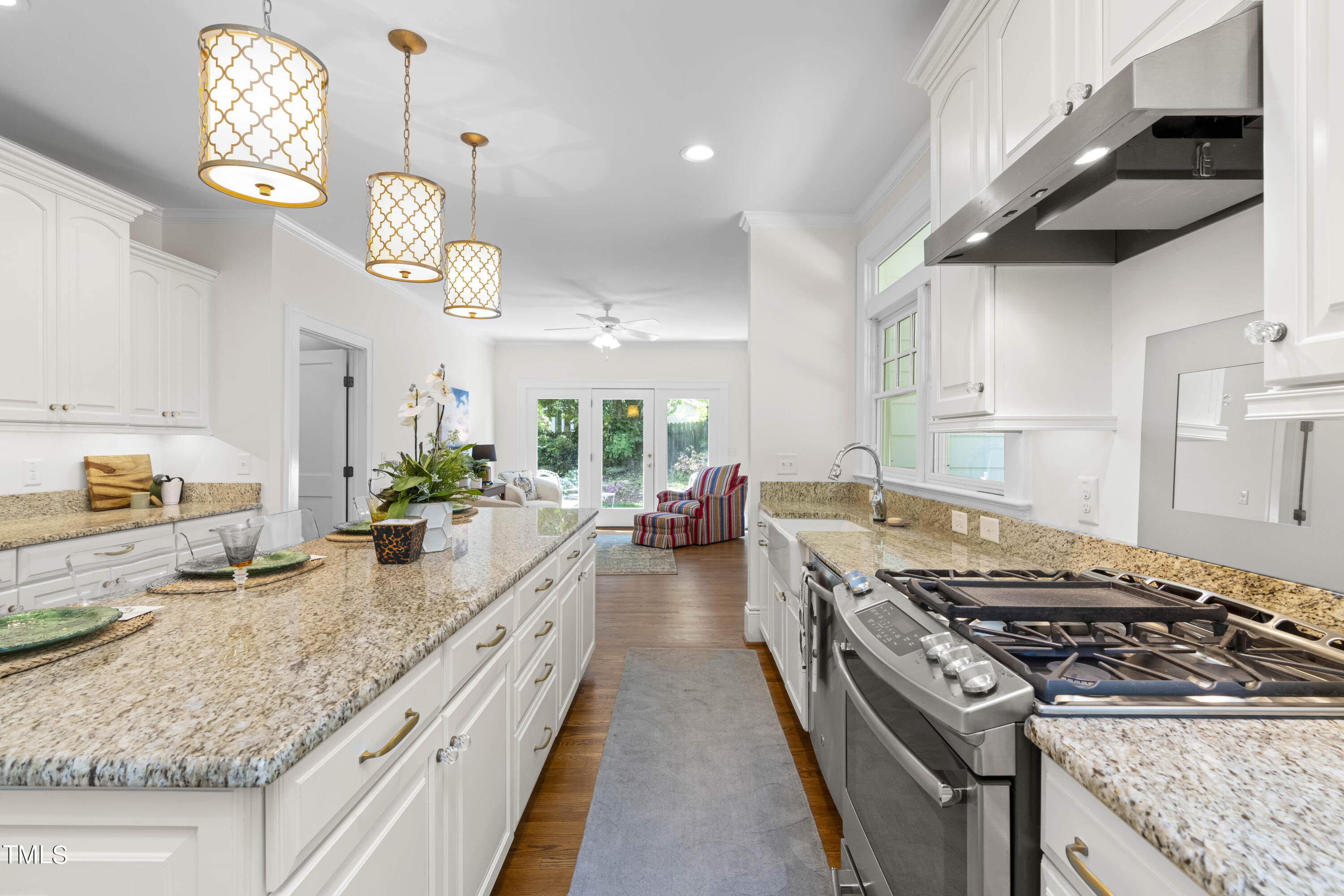 504 Holden Street Raleigh, NC 27604 - Photo 7 of 26 a kitchen with a stove and a white cabinets