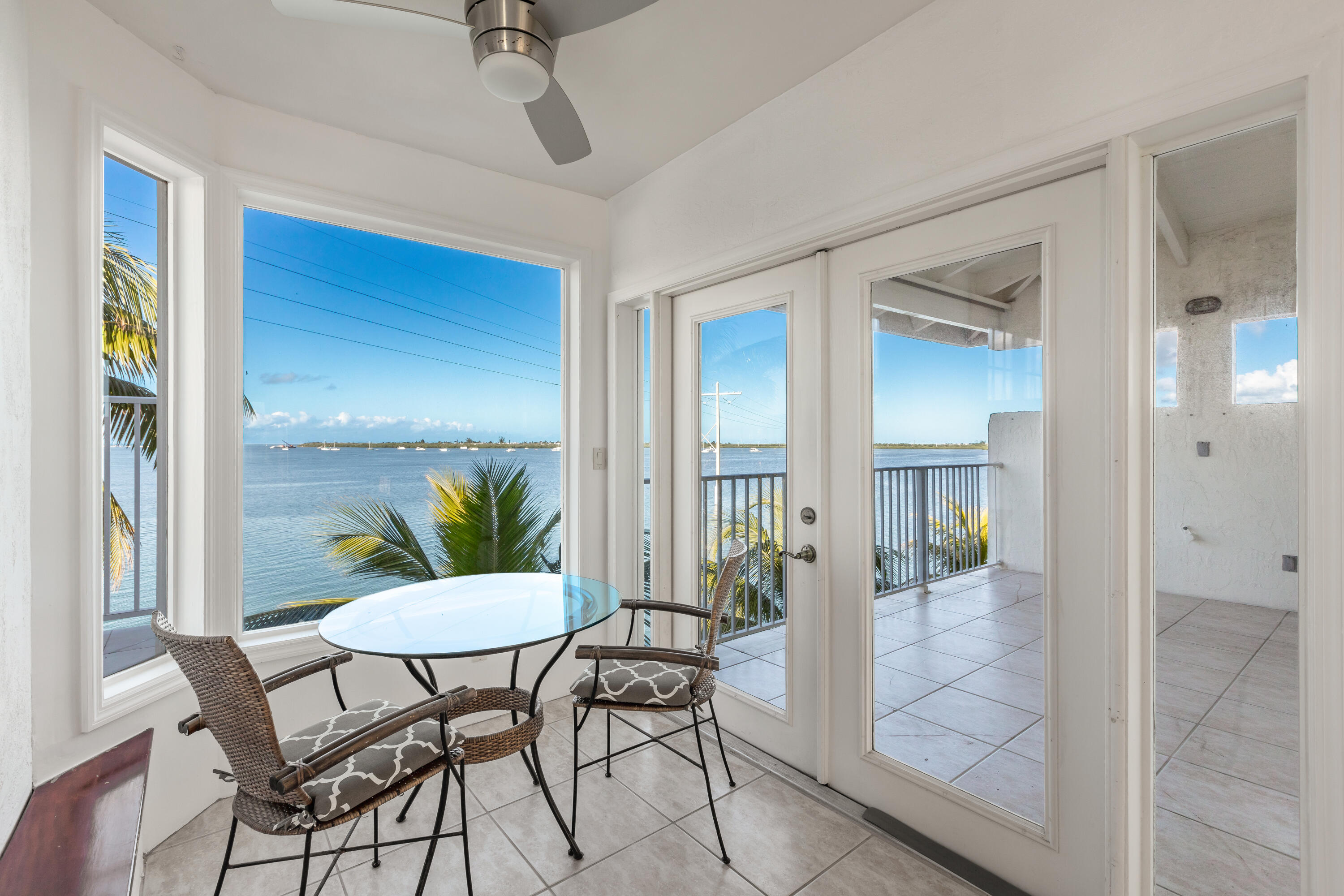 32 Hilton Haven Road, Unit 6 Key West, FL 33040 - Photo 11 of 26 a view of a livingroom with a dinning area livingroom view and wooden floor
