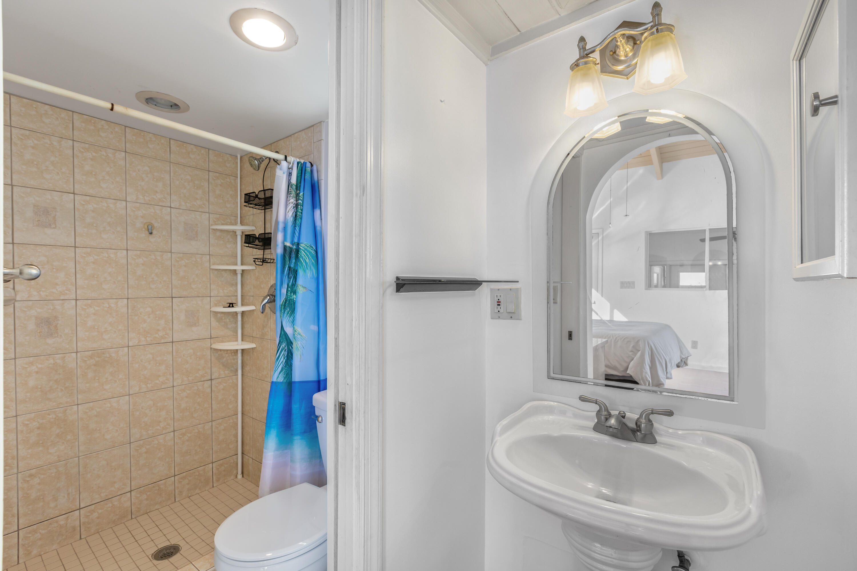 32 Hilton Haven Road, Unit 6 Key West, FL 33040 - Photo 18 of 26 a bathroom with a sink toilet and shower