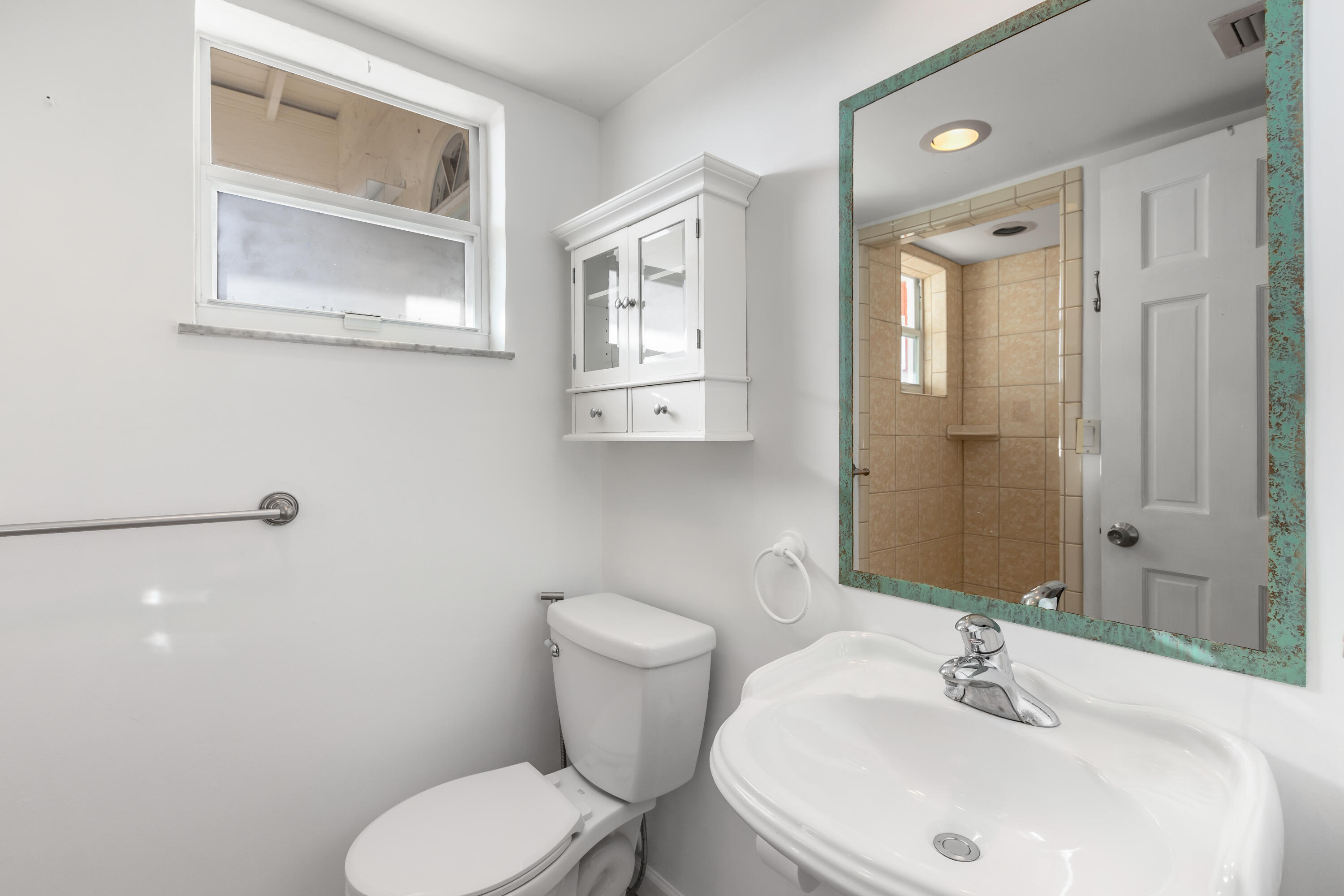 32 Hilton Haven Road, Unit 6 Key West, FL 33040 - Photo 21 of 26 a bathroom with a sink toilet and mirror