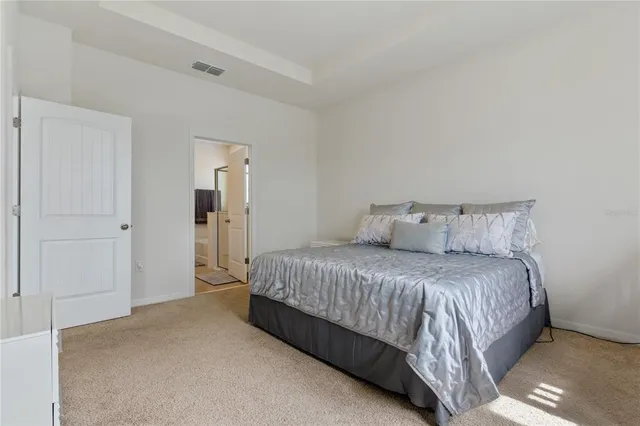 a bed room with a bed and a dresser