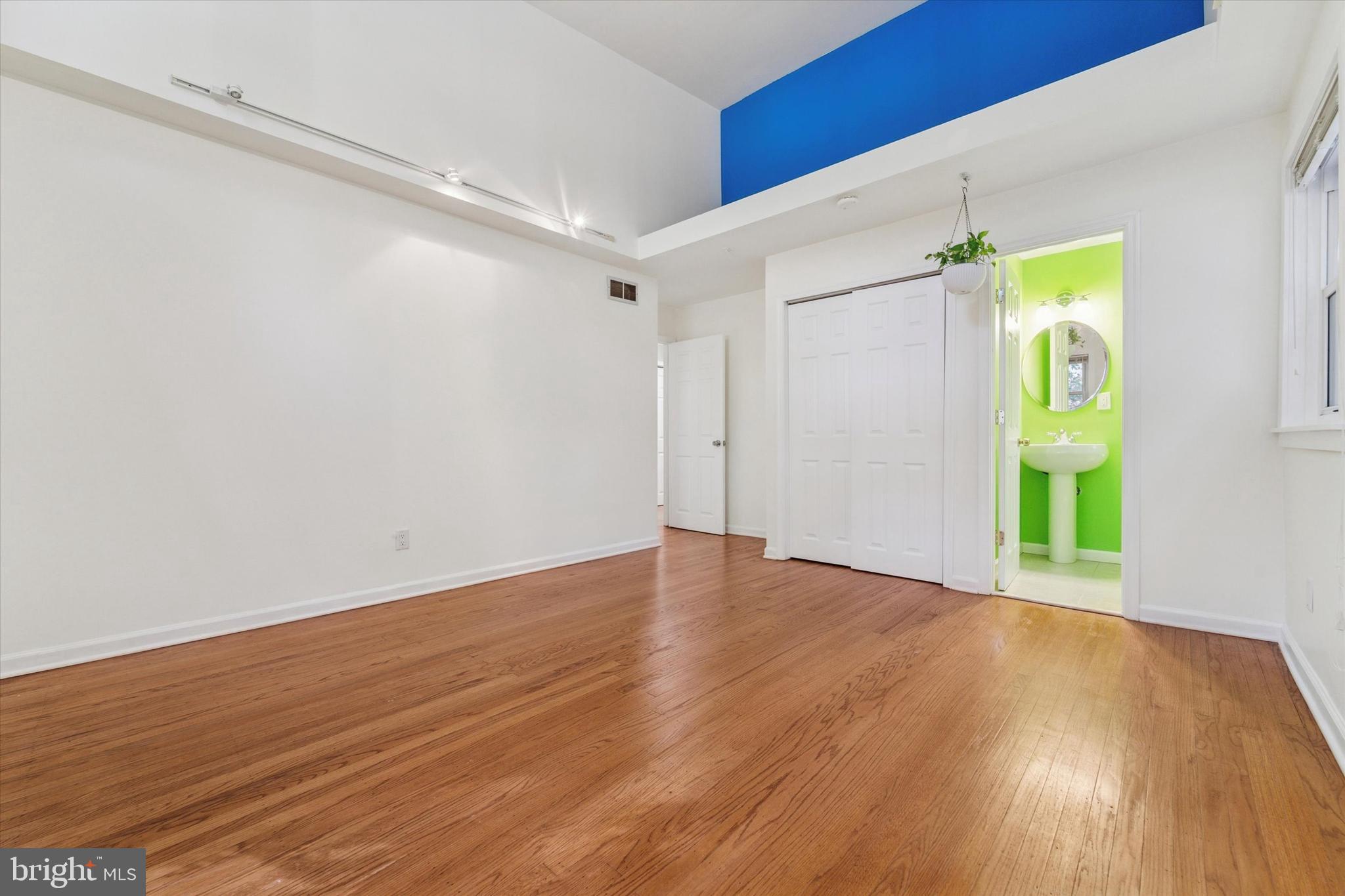 679 Crestwood Road Wayne, PA 19087 - Photo 13 of 19 a view of an empty room with wooden floor and a window