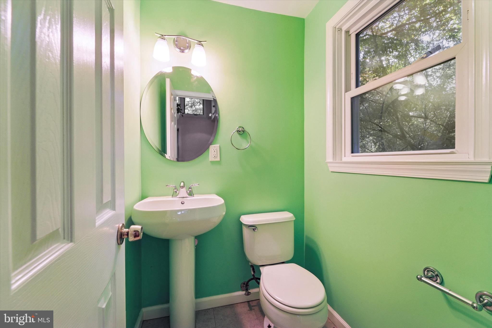 679 Crestwood Road Wayne, PA 19087 - Photo 14 of 19 a bathroom with a toilet sink and mirror
