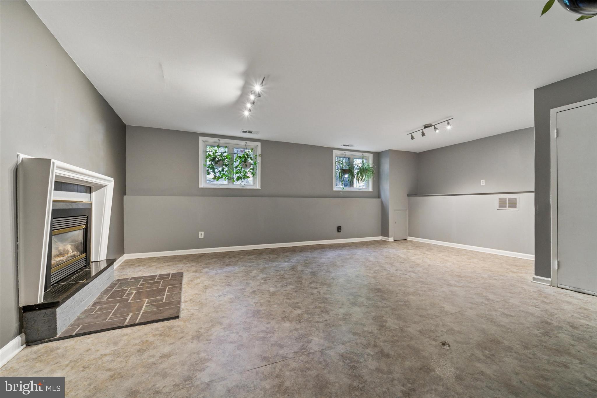 679 Crestwood Road Wayne, PA 19087 - Photo 17 of 19 a view of an empty room with a window and a kitchen