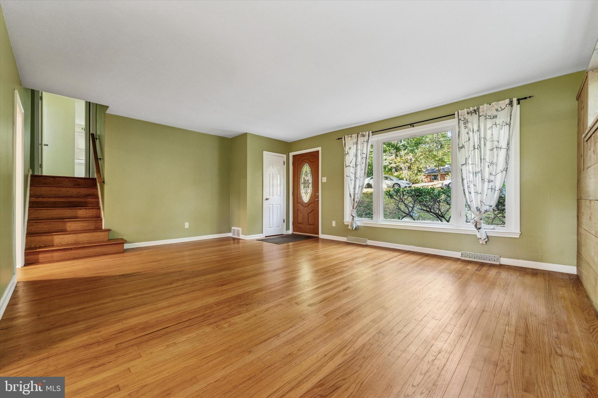 679 Crestwood Road Wayne, PA 19087 - Photo 5 of 19 a view of empty room with wooden floor and fan