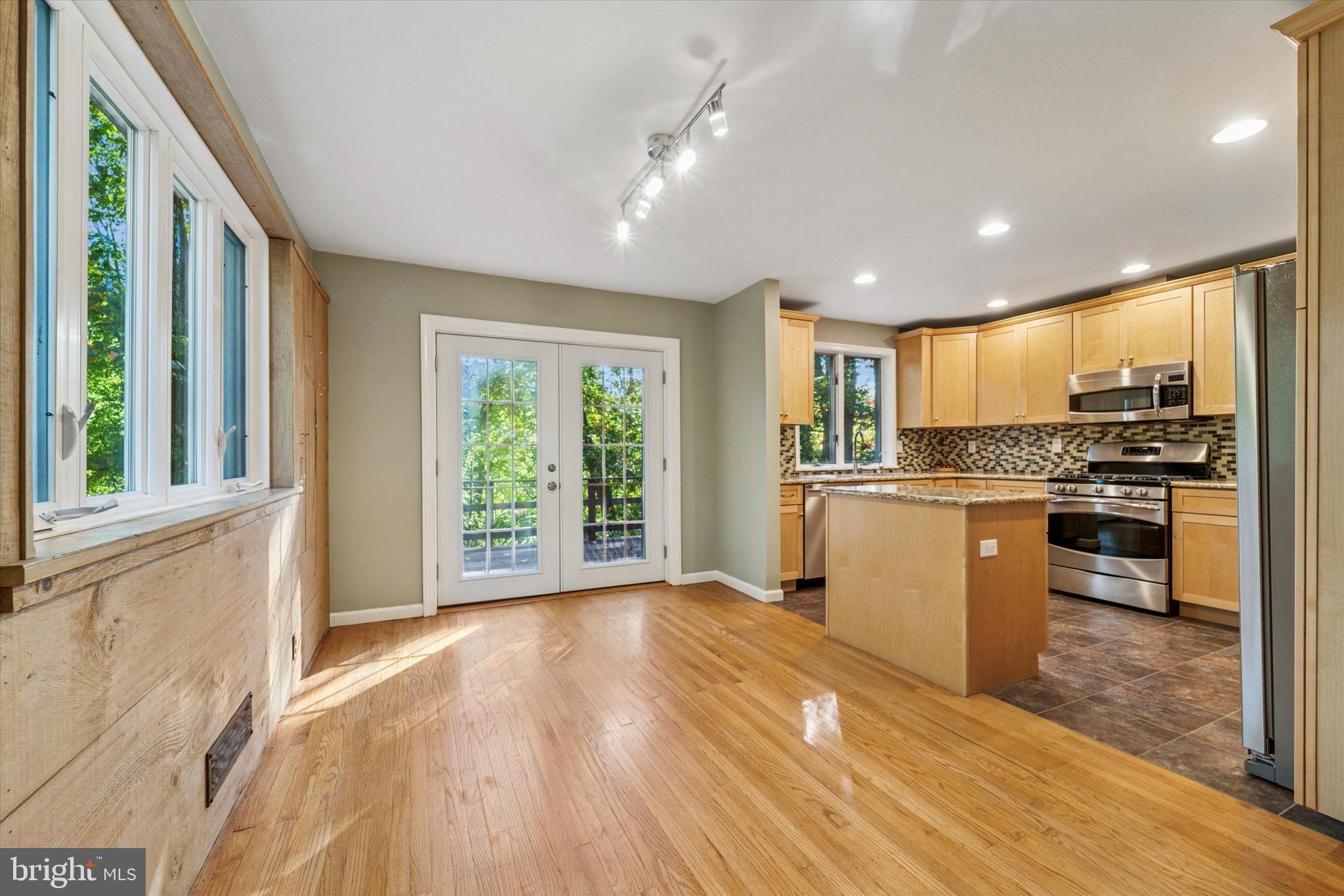 679 Crestwood Road Wayne, PA 19087 - Photo 6 of 19 a kitchen with a refrigerator and a stove top oven