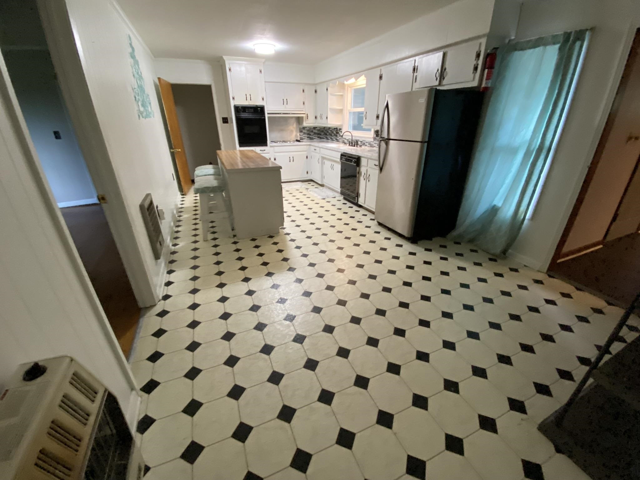 639 Beacon Road Parsons, TN 38363 - Photo 4 of 26 a kitchen with a refrigerator and a sink