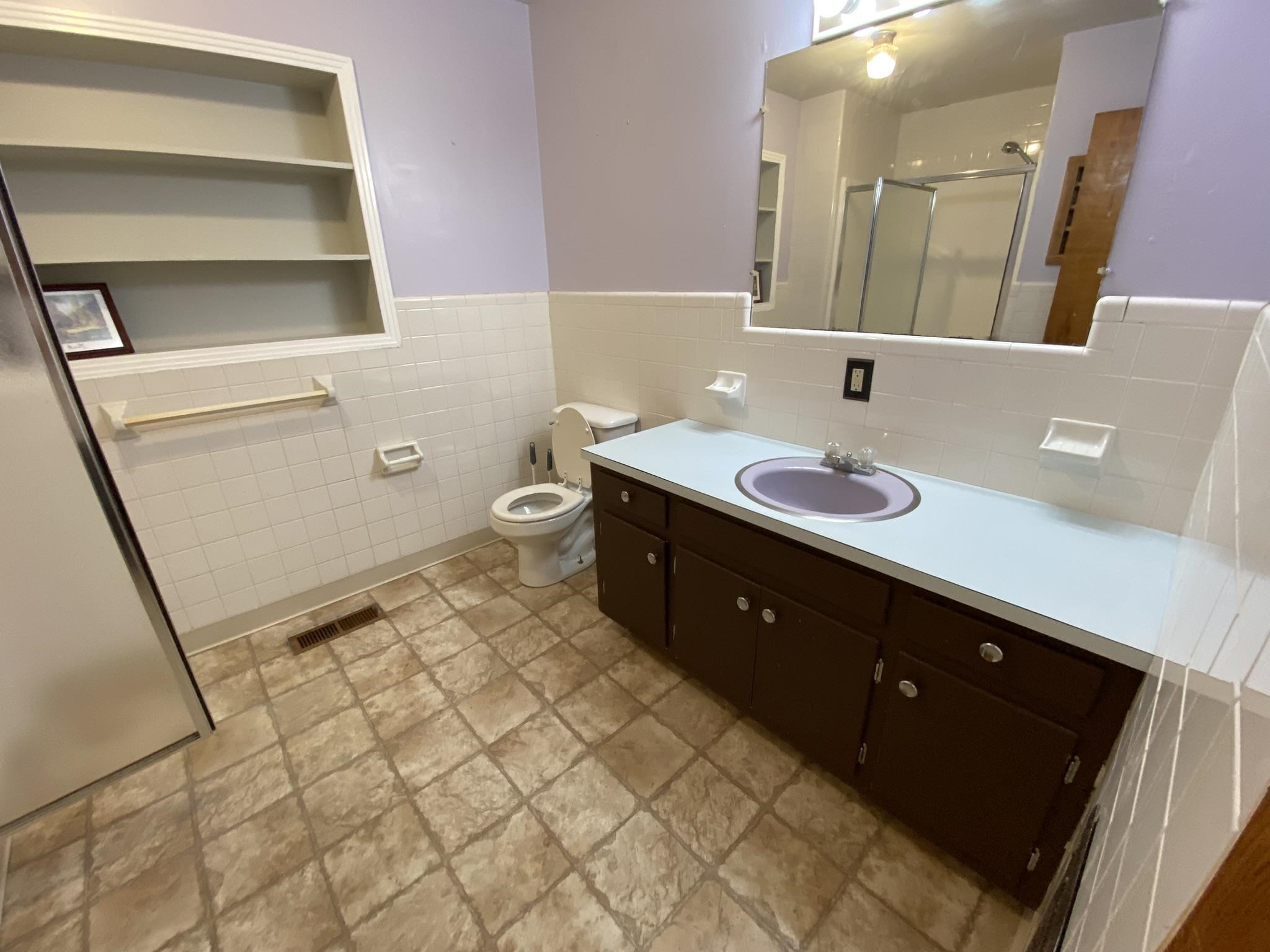 639 Beacon Road Parsons, TN 38363 - Photo 8 of 26 a spacious bathroom with a double vanity sink a mirror and a