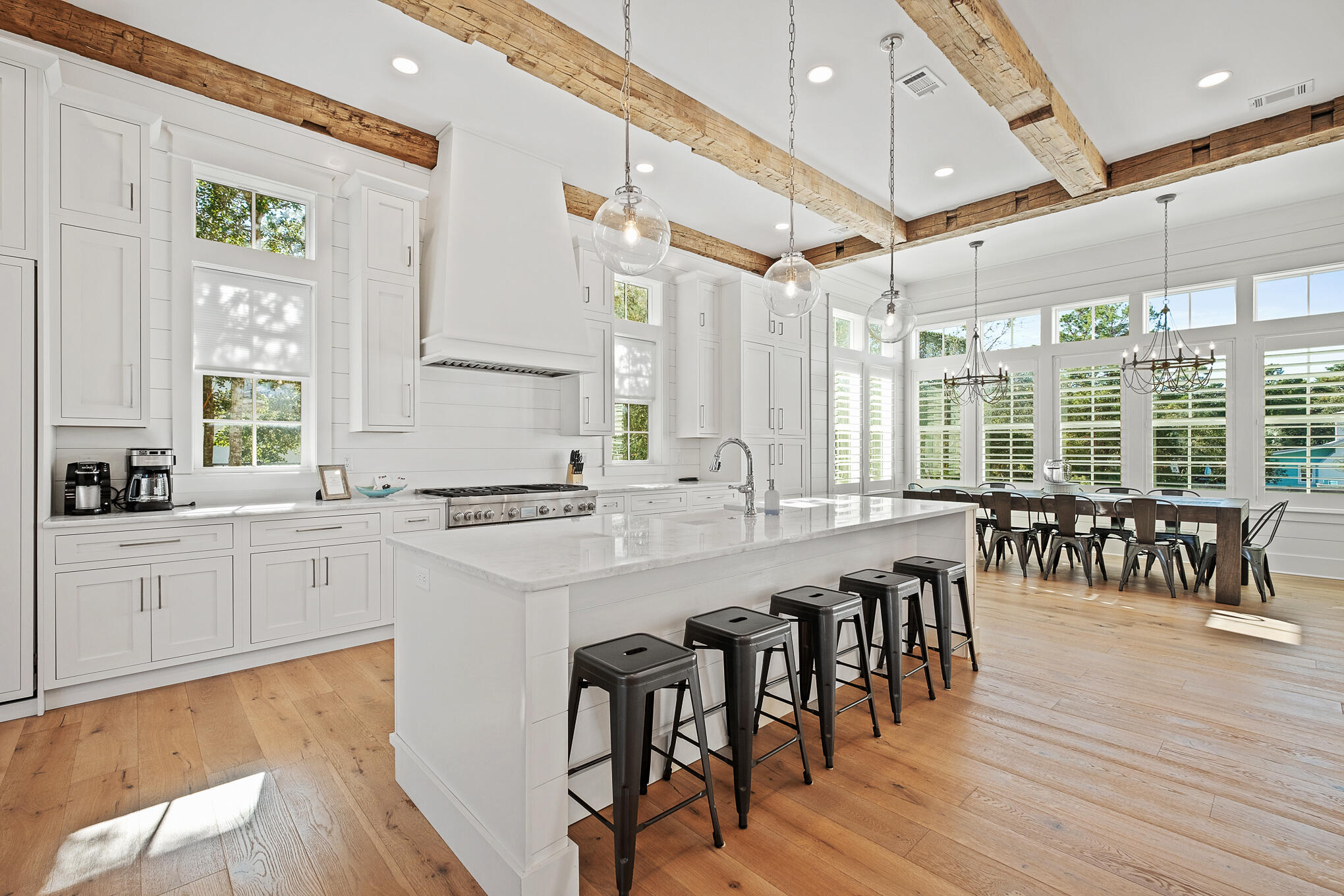 27 Sand Dunes Road Santa Rosa Beach, FL 32459 - Photo 13 of 74 a large white kitchen with lots of table and chairs