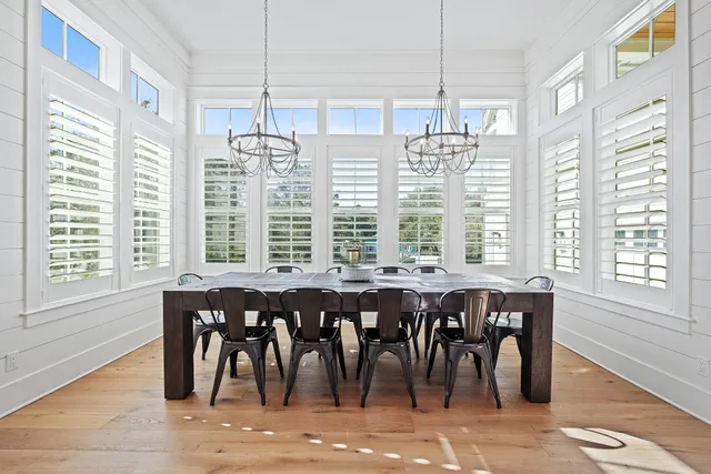 a view of a hallway with wooden floor and closet