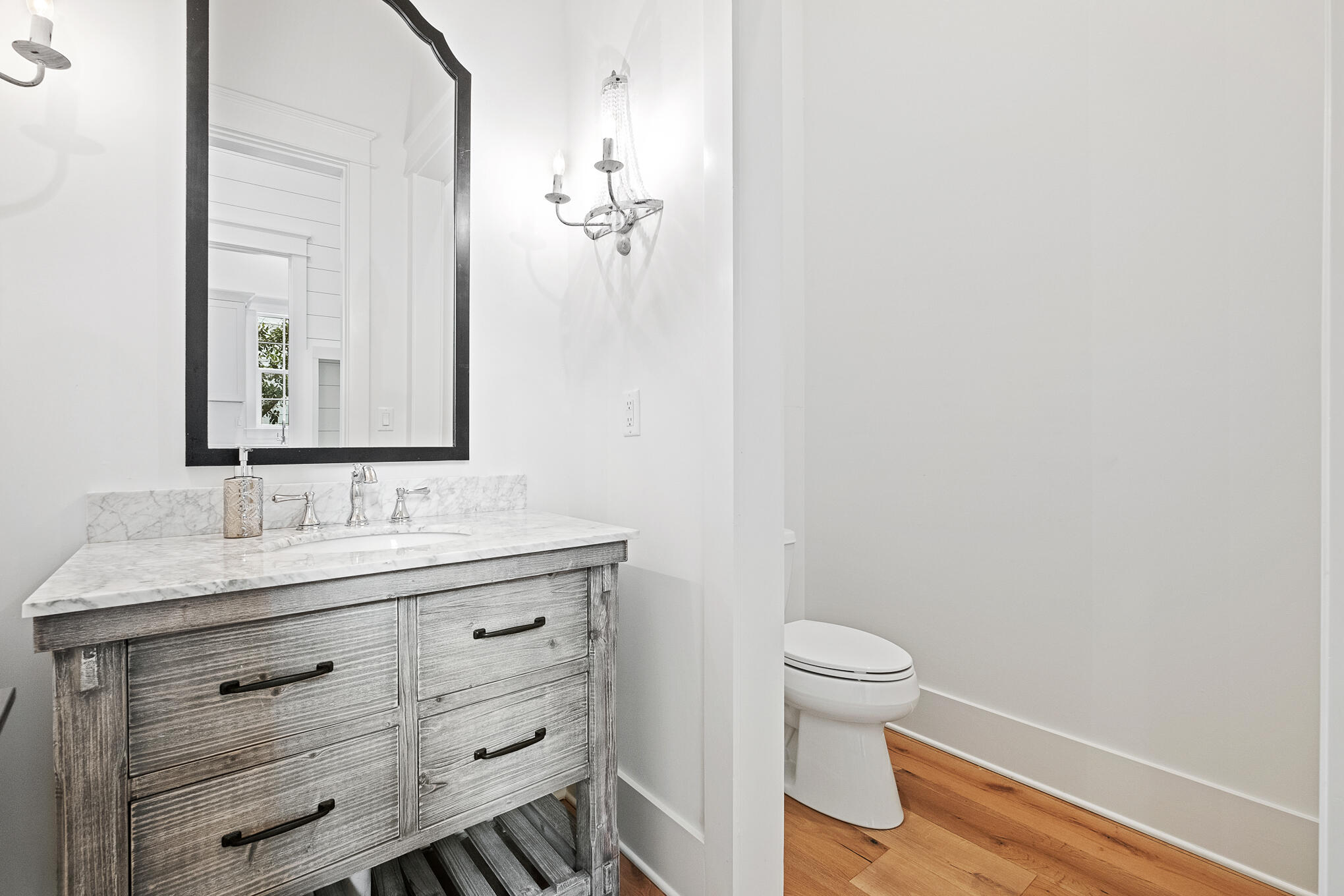 27 Sand Dunes Road Santa Rosa Beach, FL 32459 - Photo 17 of 74 a bathroom with a sink a toilet and a mirror