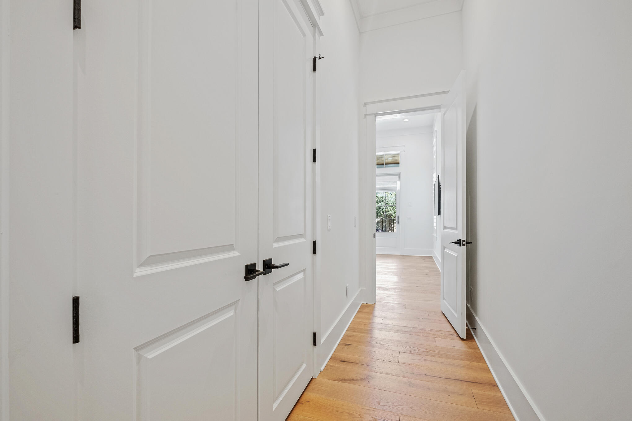 27 Sand Dunes Road Santa Rosa Beach, FL 32459 - Photo 20 of 74 a view of a hallway with wooden floor and closet