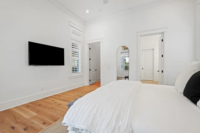 a bathroom with a white tub sitting next to a sink