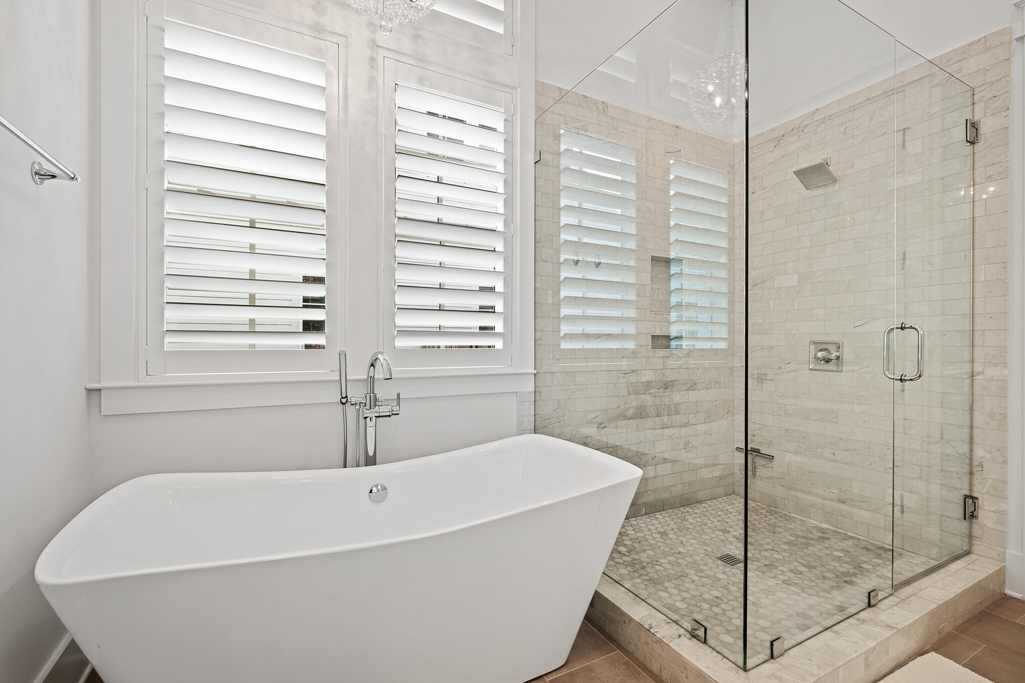 27 Sand Dunes Road Santa Rosa Beach, FL 32459 - Photo 23 of 74 a white bath tub sitting in a bathroom next to a window