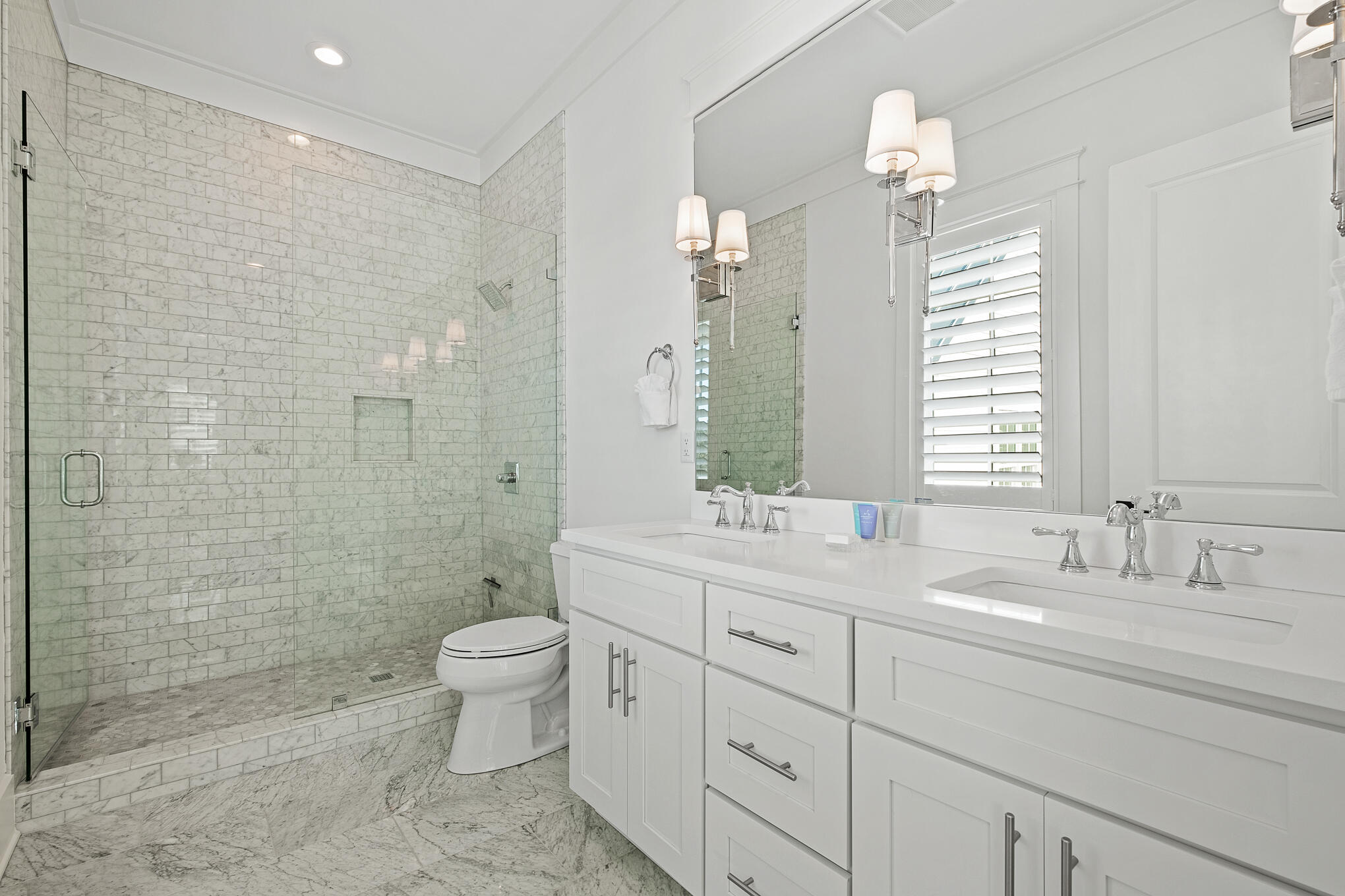 27 Sand Dunes Road Santa Rosa Beach, FL 32459 - Photo 34 of 74 a bathroom with a double vanity sink toilet and shower