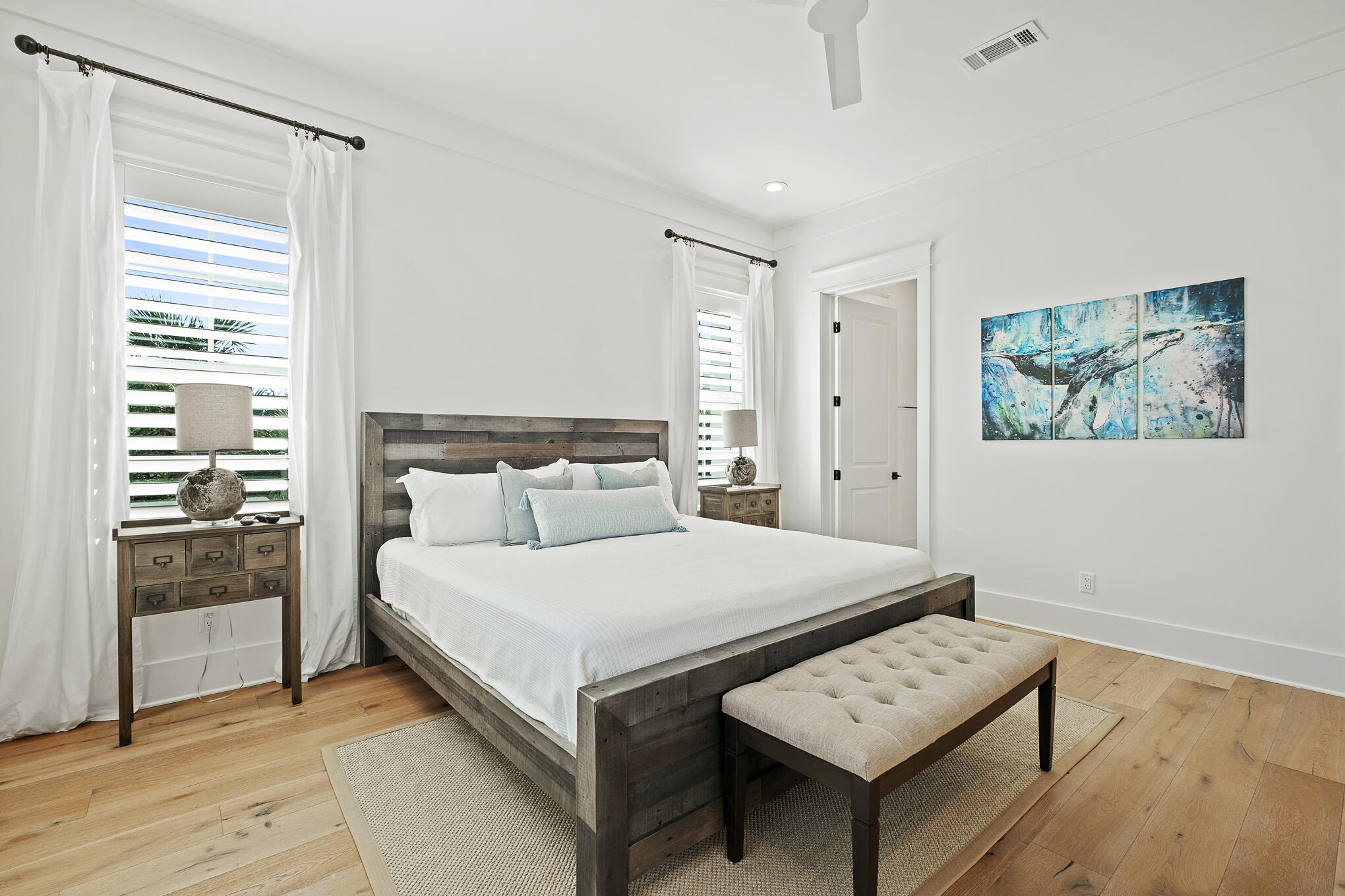 27 Sand Dunes Road Santa Rosa Beach, FL 32459 - Photo 38 of 74 a bedroom with a bed a mirror and a large window