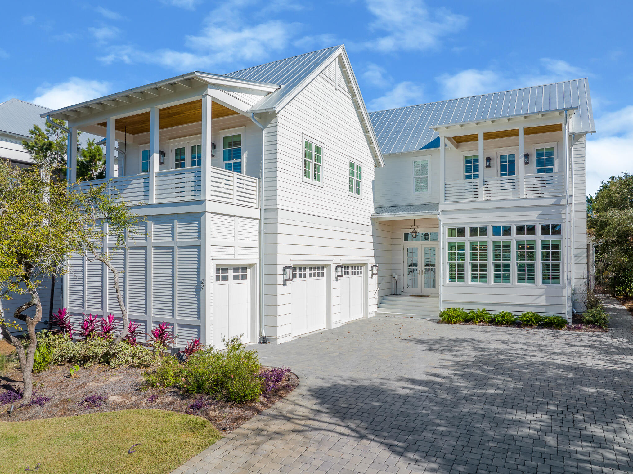 27 Sand Dunes Road Santa Rosa Beach, FL 32459 - Photo 4 of 74 a front view of a house with a yard and potted plants