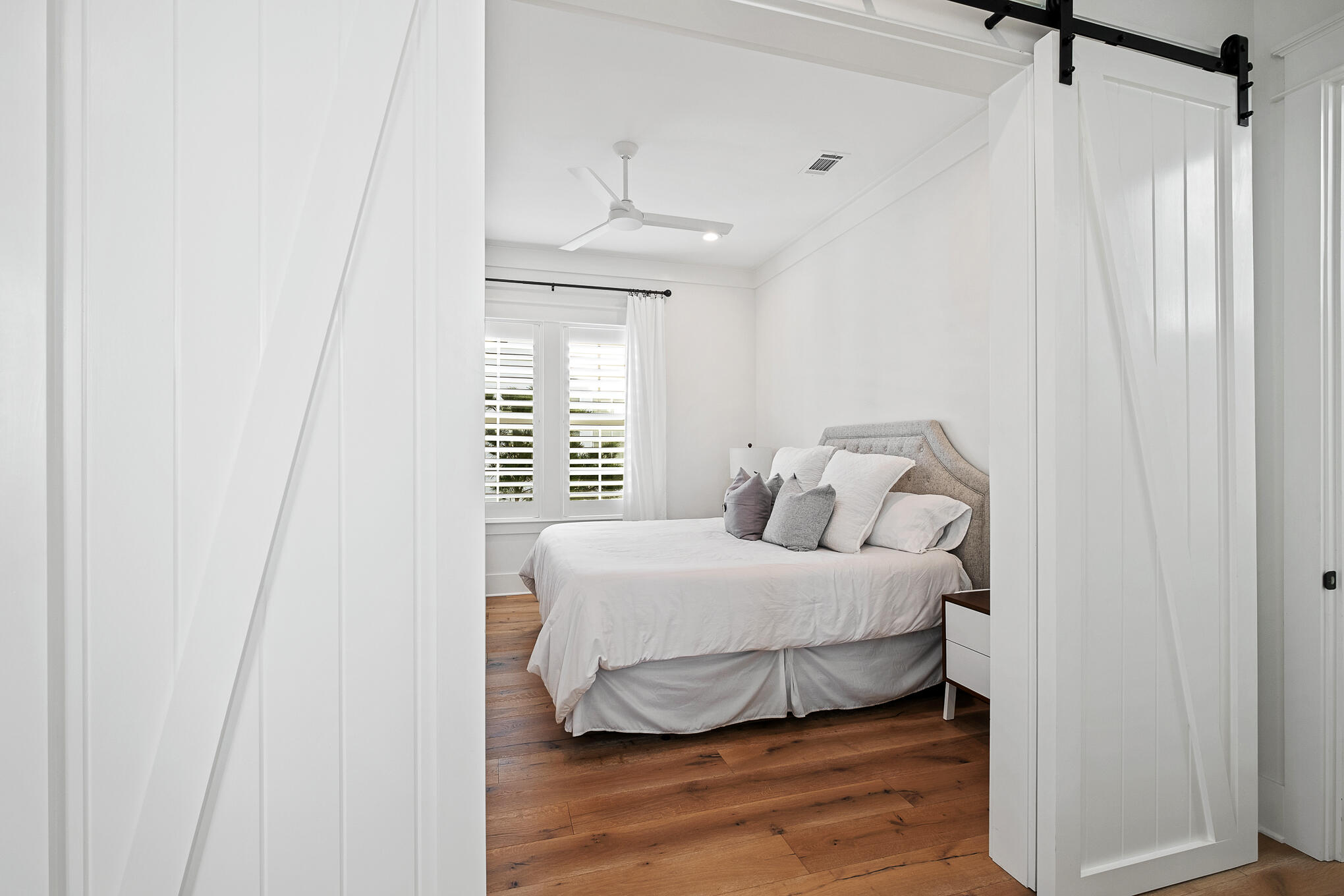27 Sand Dunes Road Santa Rosa Beach, FL 32459 - Photo 41 of 74 a bedroom with a bed and wooden floor