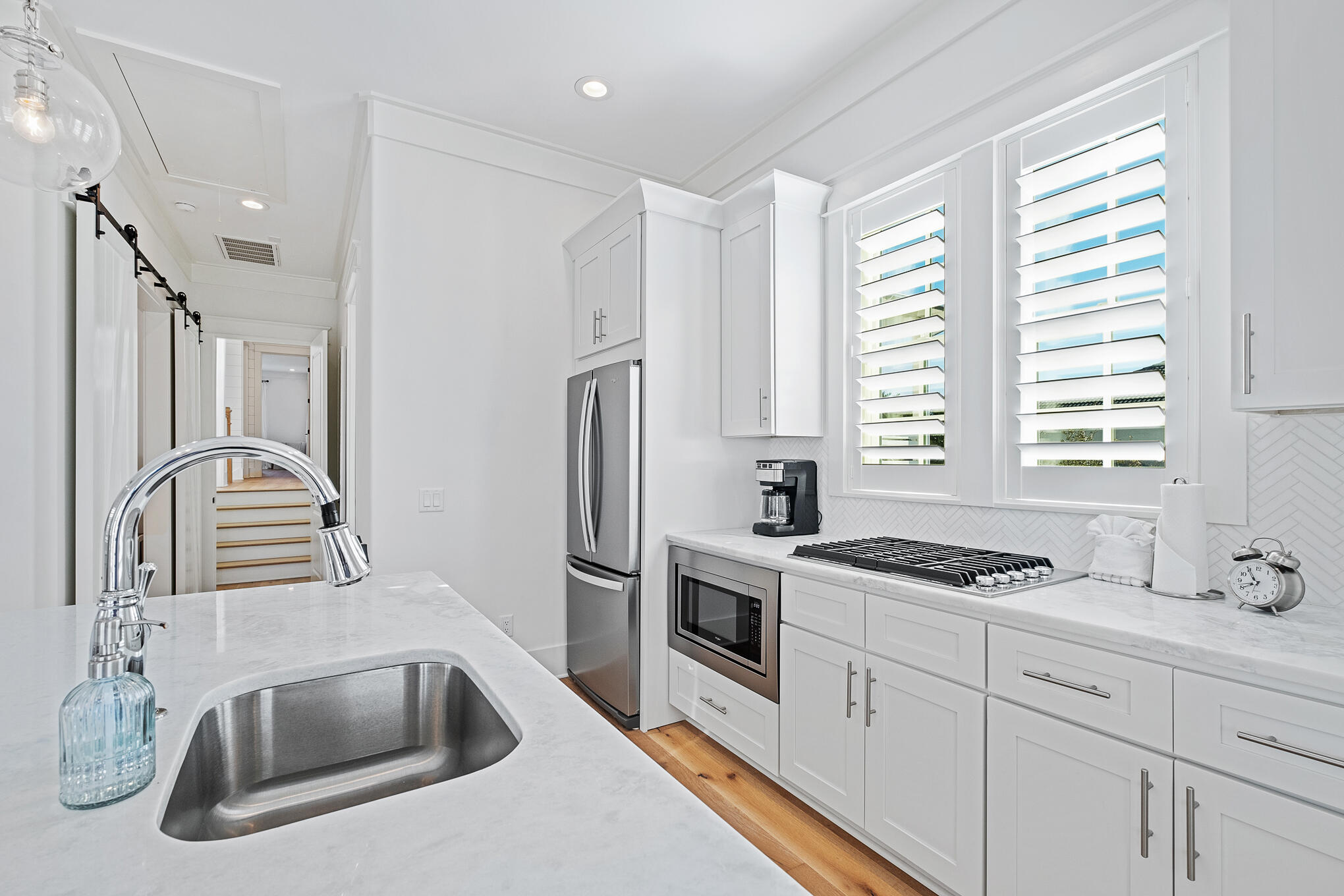 27 Sand Dunes Road Santa Rosa Beach, FL 32459 - Photo 46 of 74 a kitchen with stainless steel appliances granite countertop a sink stove and refrigerator
