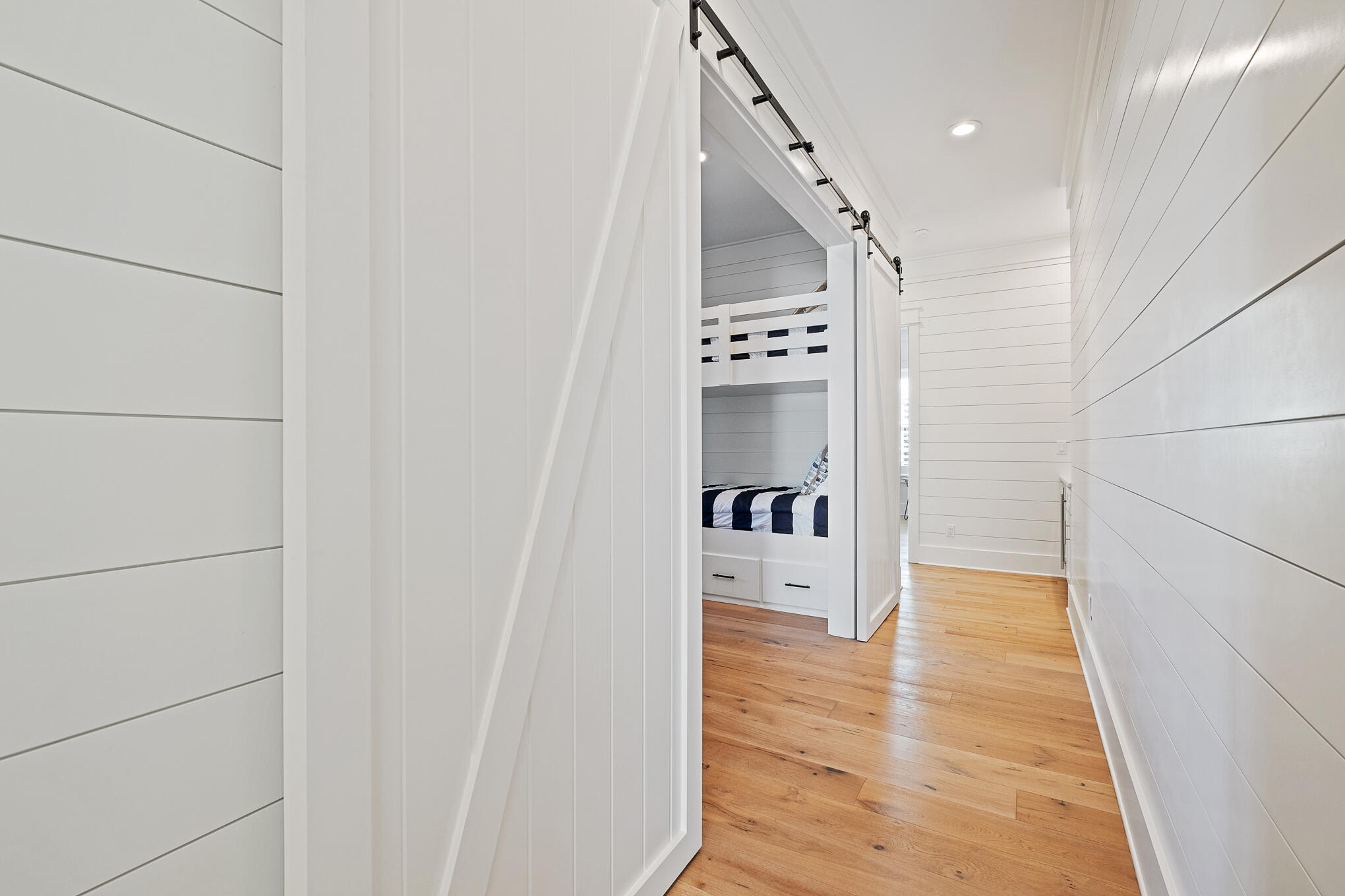 27 Sand Dunes Road Santa Rosa Beach, FL 32459 - Photo 49 of 74 a walk in closet with wooden floor