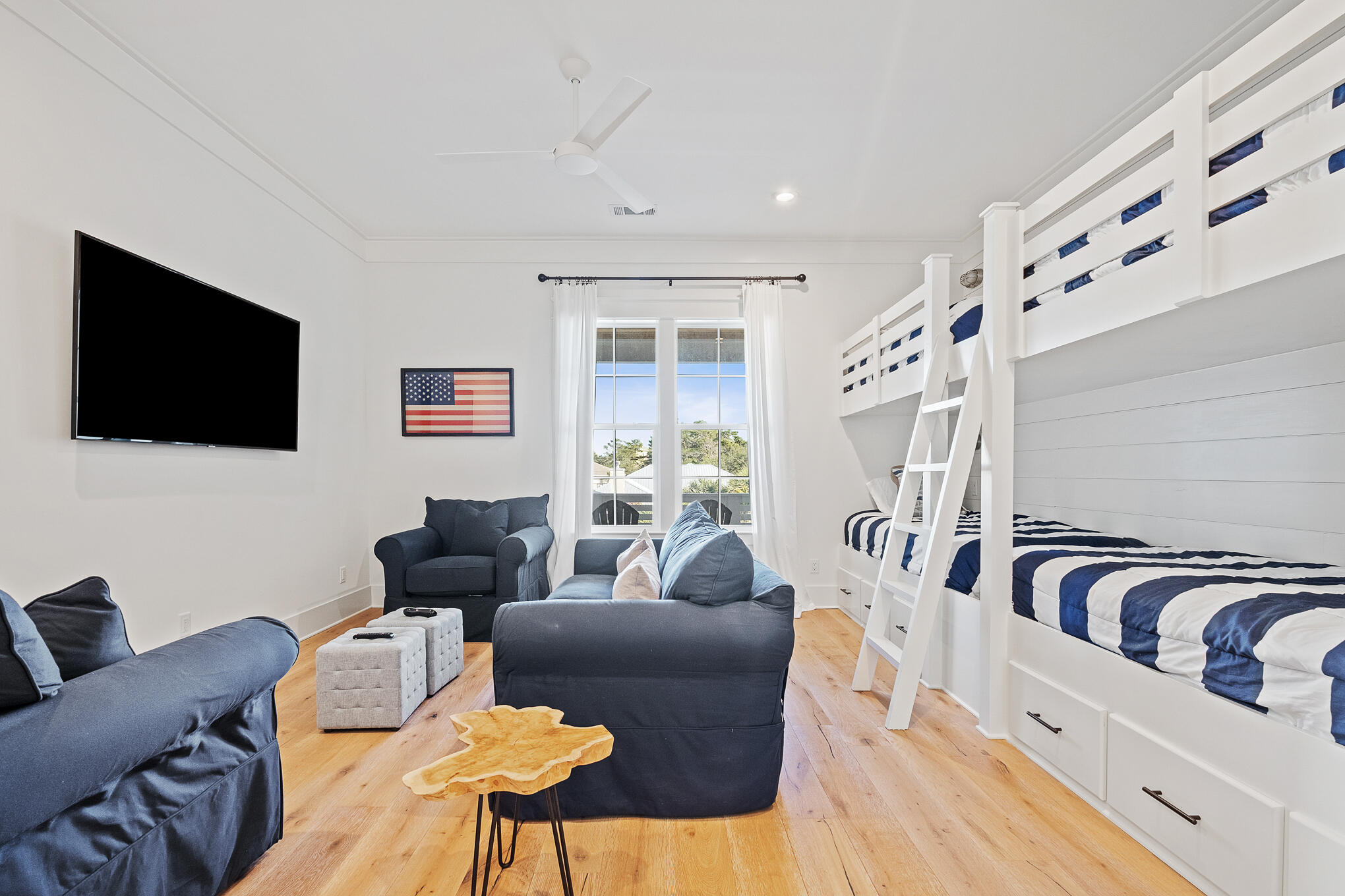 27 Sand Dunes Road Santa Rosa Beach, FL 32459 - Photo 52 of 74 a living room with furniture and a flat screen tv
