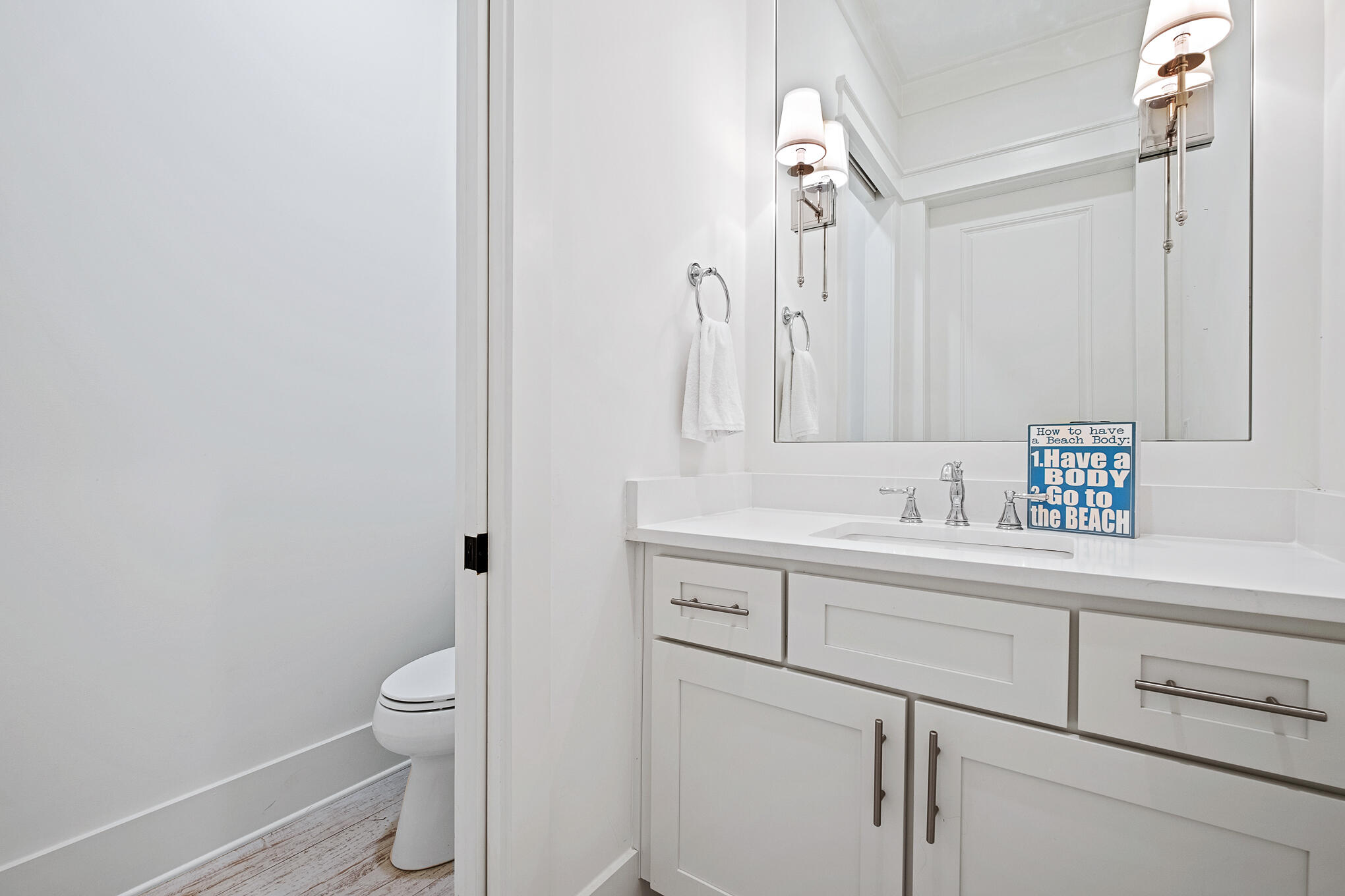 27 Sand Dunes Road Santa Rosa Beach, FL 32459 - Photo 55 of 74 a bathroom with a sink a toilet and a mirror
