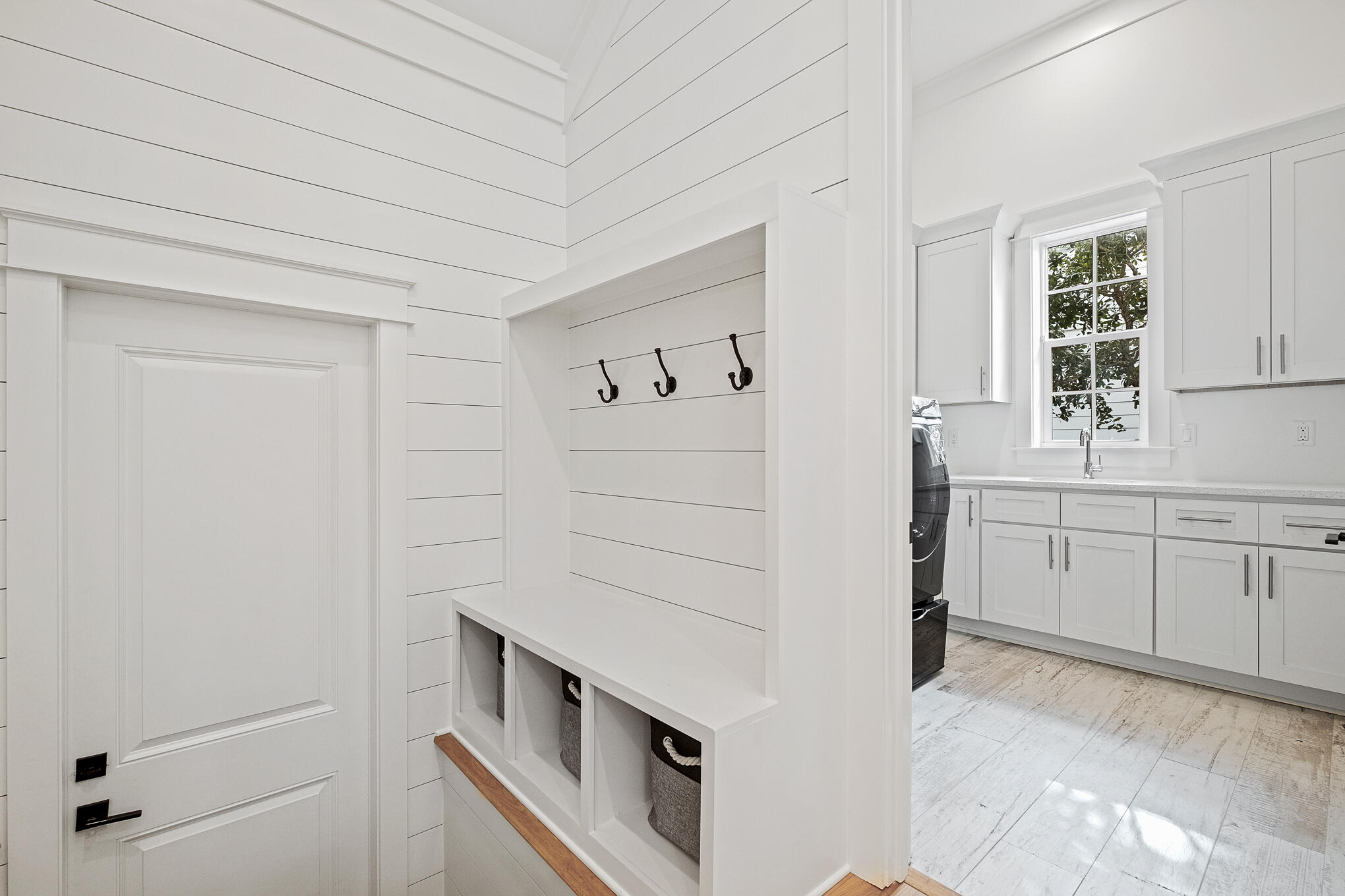 27 Sand Dunes Road Santa Rosa Beach, FL 32459 - Photo 7 of 74 a kitchen with white cabinets and white appliances