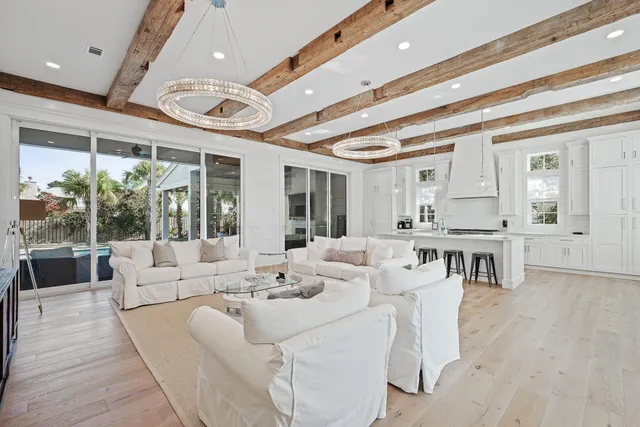 a large white kitchen with lots of table and chairs