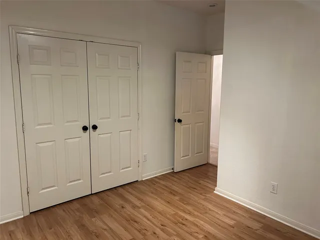 a view of room with hardwood floor