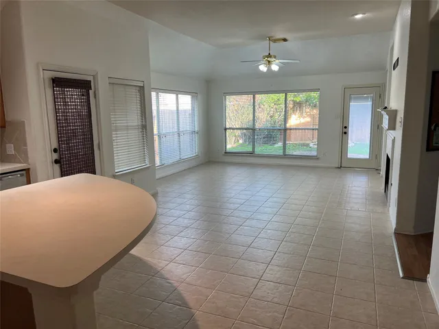 a view of a room with window and hardwood floor