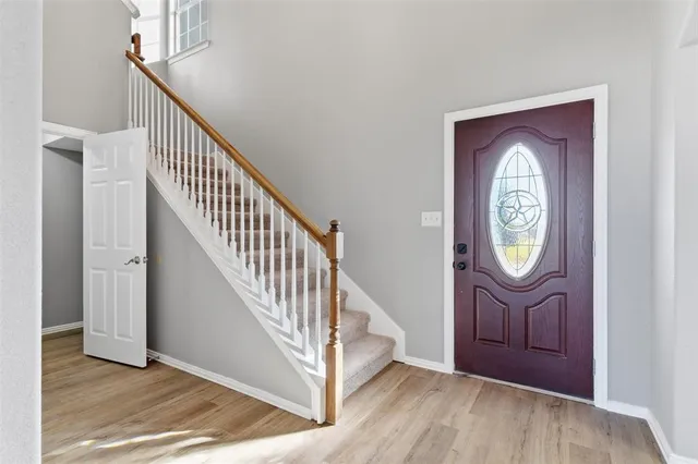a view of entryway with wooden floor