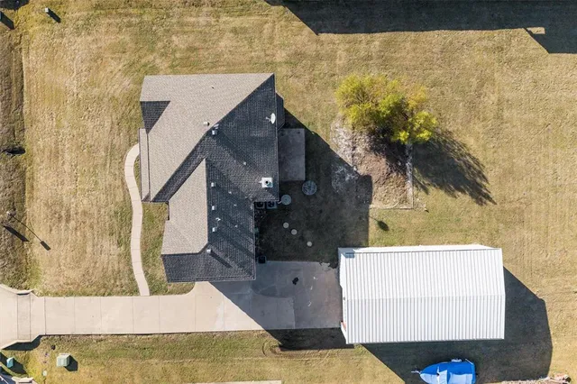 an aerial view of a houses with outdoor space