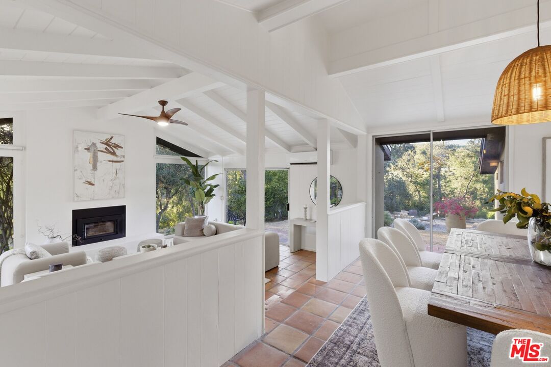 3100 Santa Maria Road Topanga, CA 90290 - Photo 11 of 66 a living room with furniture large window and flat screen tv