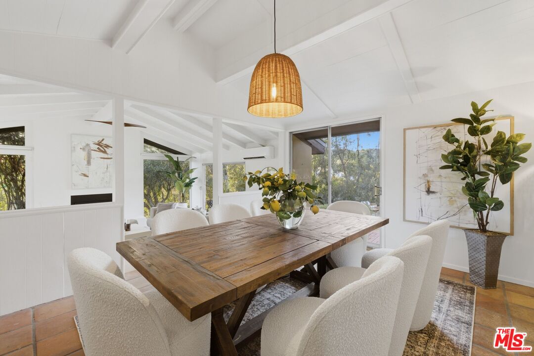 3100 Santa Maria Road Topanga, CA 90290 - Photo 12 of 66 a view of a dining room with furniture and a potted plant