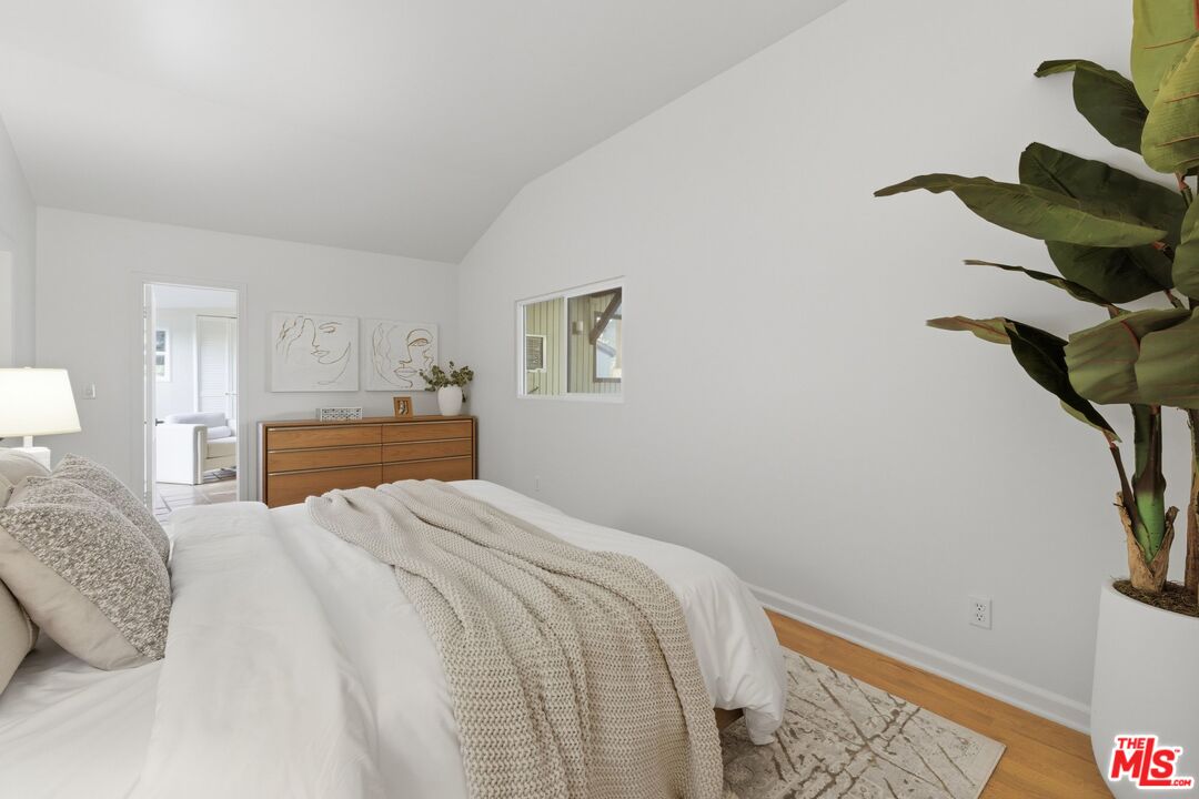 3100 Santa Maria Road Topanga, CA 90290 - Photo 20 of 66 a bedroom with a bed and a painting on the wall