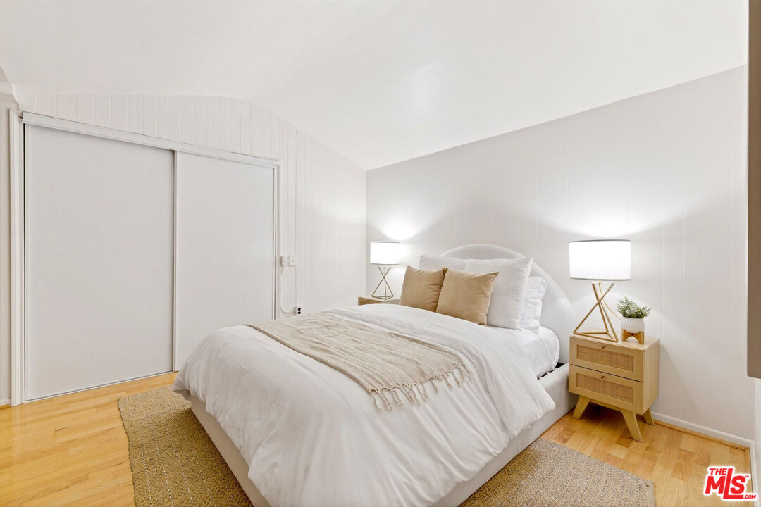 3100 Santa Maria Road Topanga, CA 90290 - Photo 28 of 66 a bedroom with a bed and a night stand