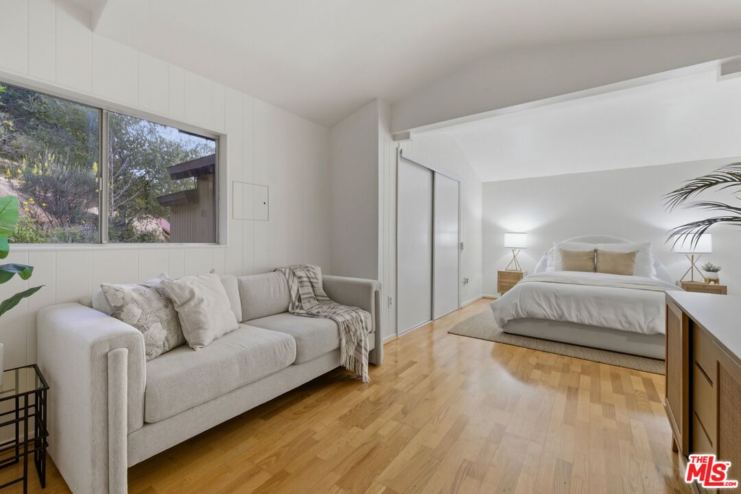 3100 Santa Maria Road Topanga, CA 90290 - Photo 29 of 66 a living room with a bed and a couch