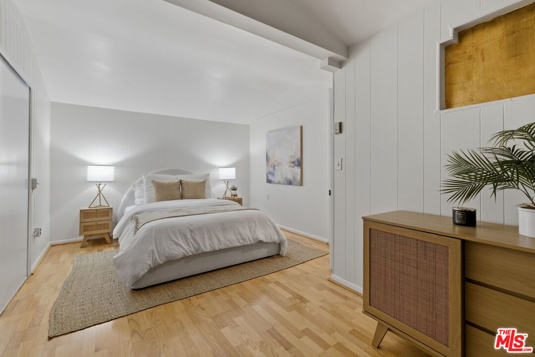 3100 Santa Maria Road Topanga, CA 90290 - Photo 30 of 66 a bedroom with a bed and a potted plant on the dresser