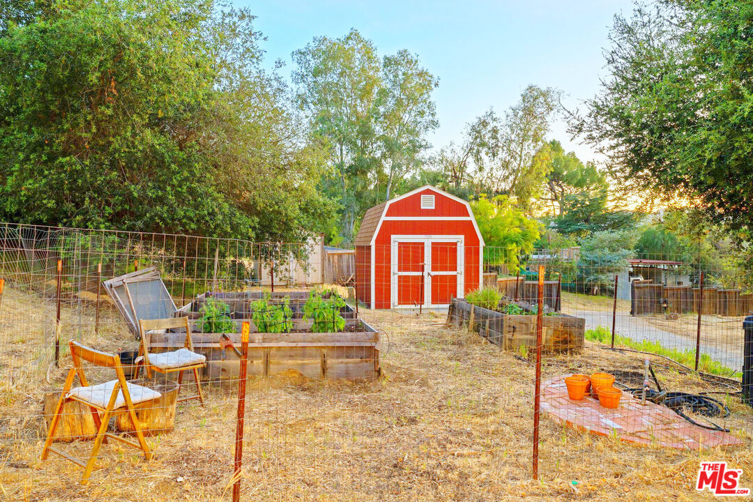 3100 Santa Maria Road Topanga, CA 90290 - Photo 39 of 66 a view of a swimming pool with a lounge chair