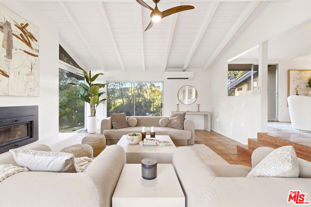 3100 Santa Maria Road Topanga, CA 90290 - Photo 5 of 66 a living room with furniture and a fireplace