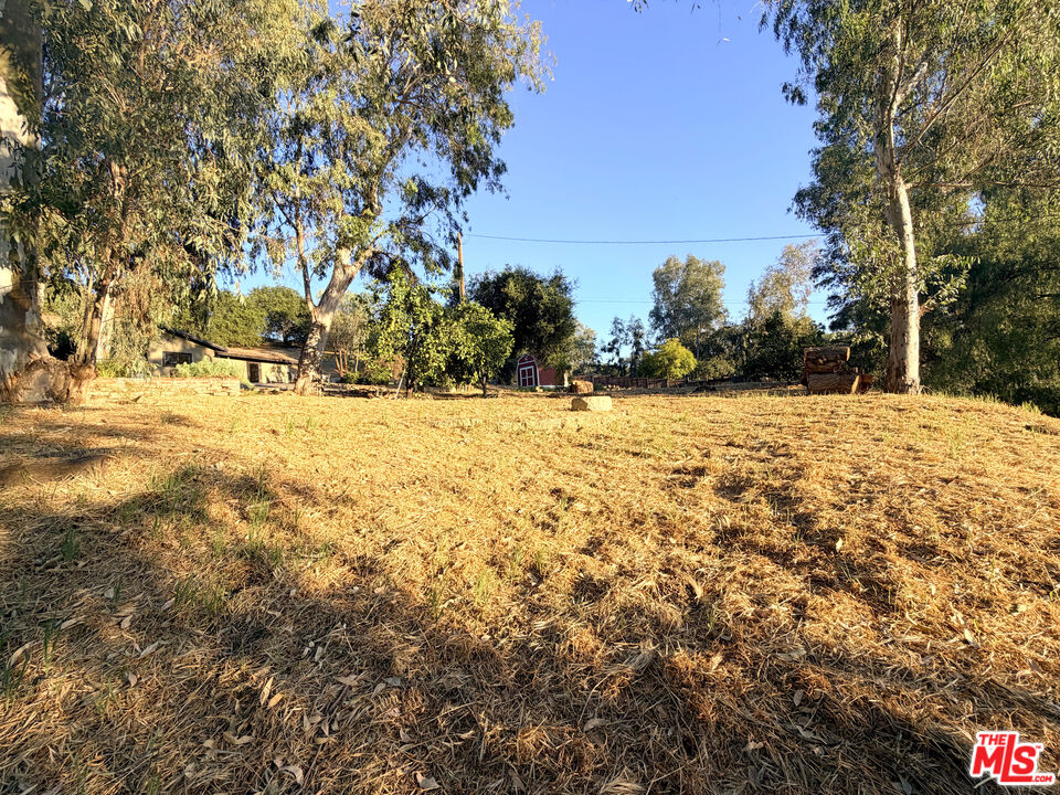 3100 Santa Maria Road Topanga, CA 90290 - Photo 58 of 66 a view of white house with a yard