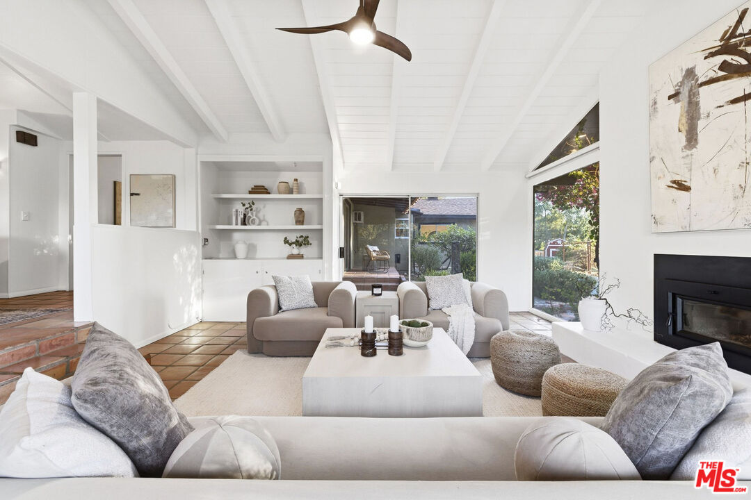 3100 Santa Maria Road Topanga, CA 90290 - Photo 7 of 66 a living room with furniture fireplace and a large window