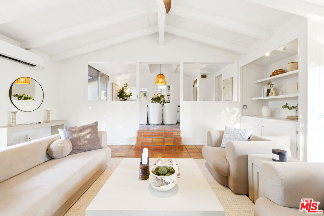 3100 Santa Maria Road Topanga, CA 90290 - Photo 8 of 66 a living room with furniture and wall paintings