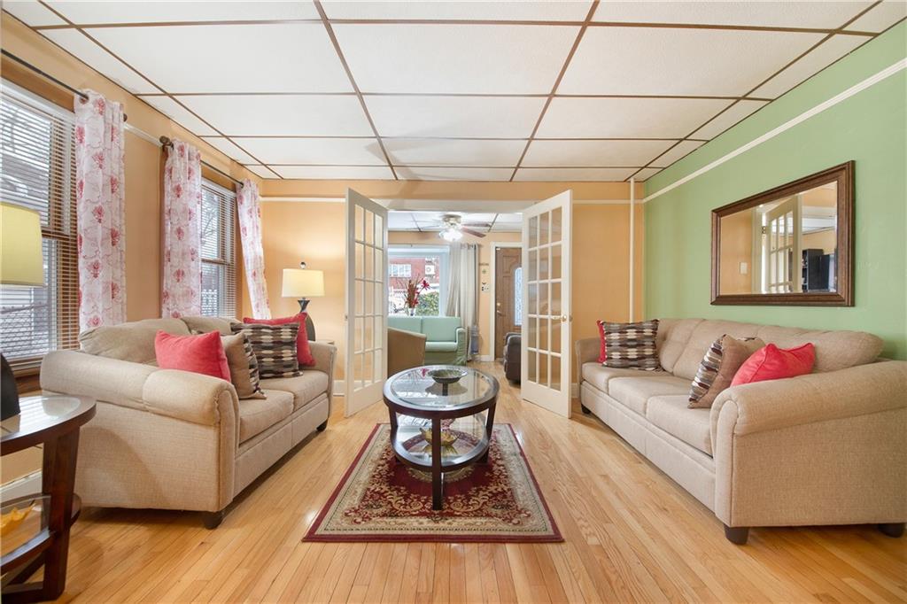 5905 Ave. M Brooklyn, NY 11234 - Photo 4 of 12 a living room with furniture and a large window