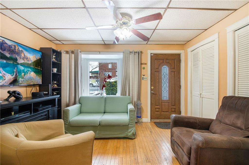5905 Ave. M Brooklyn, NY 11234 - Photo 7 of 12 a living room with furniture and a flat screen tv