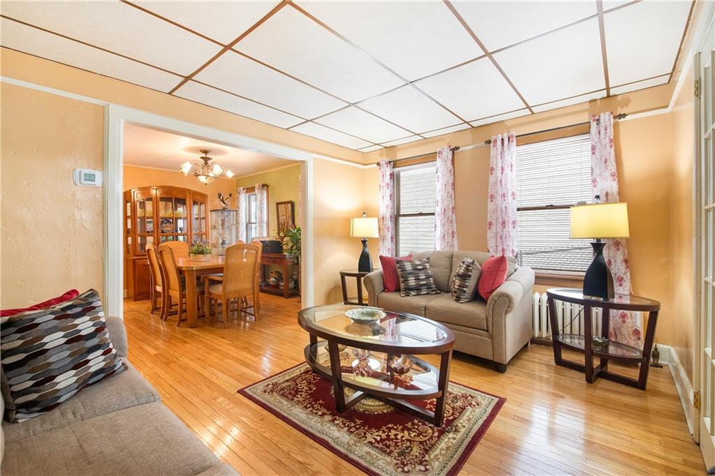 5905 Ave. M Brooklyn, NY 11234 - Photo 8 of 12 a living room with furniture and a wooden floor